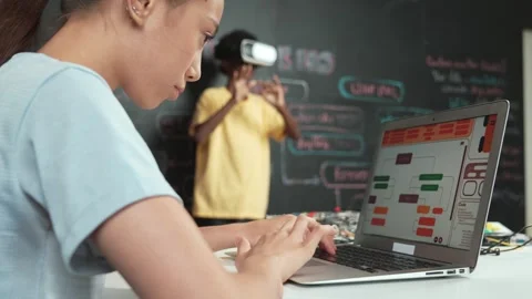 Closeup of school girl hand coding program while student using VR. Edification Stock Footage 279894085
