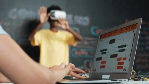 Closeup of school girl hand coding program while student using VR. Edification Stock Footage 283886075