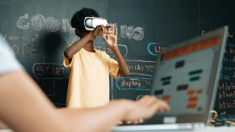 Closeup of school girl hand coding program while student using VR. Edification. Foto stock