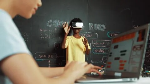 Closeup of school girl hand coding program while student using VR. Edification. Foto stock