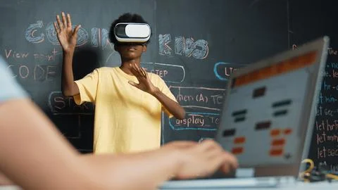 Closeup of school girl hand coding program while student using VR. Edification. Stock Photos