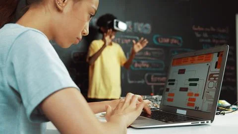 Closeup of school girl hand coding program while student using VR. Edification. Stock Photos