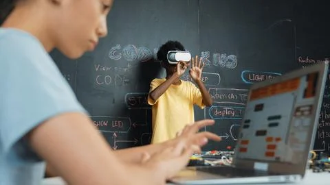 Closeup of school girl hand coding program while student using VR. Edification. 스톡 사진