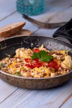 Closeup of scrambled eggs in a pan Stock Photos