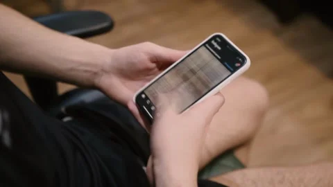 Closeup scrolling phone hand holding phone using mobile smartphone Millennial Vídeos de archivo 336249742