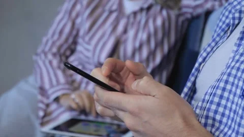 Closeup scrolling phone hand holding phone using mobile smartphone Millennial Stock-Footage 336249802