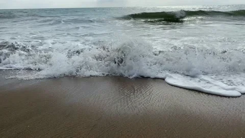 Closeup sea waves on sand beach, sand beach, waves in beach Stock Footage 167696780