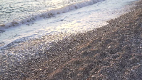 Closeup sea waves at sun light. Sunrise at Adriatic sea. Ocean waves foam. Sunny Stock Footage 125822294