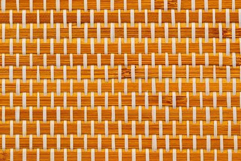 Closeup of seamless beautiful empty brown woven mat pattern wallpaper. Stock Photos