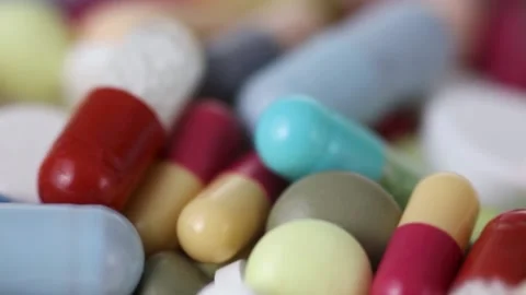 Closeup seamless loop shot of rotating pile of medication pills Stock Footage 147200238