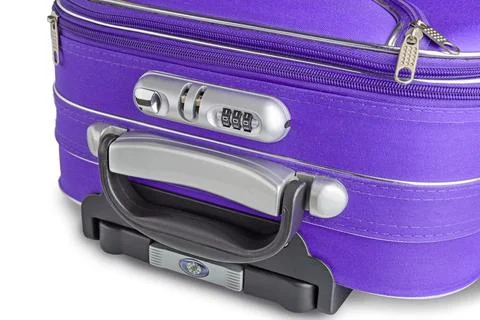 A closeup of the security code on the lock of a closed violet suitcase with Stock-Fotos