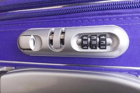 Closeup of a security padlock with three numbers on a violet suitcase ready for Stockfoto's