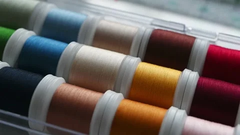 Closeup of selection of colorful threads for sewing machine. Tailoring tools. Video stock 171330817