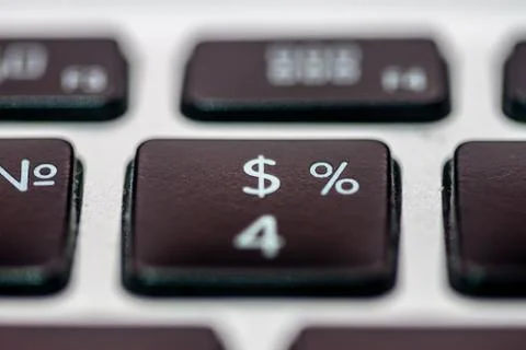 Closeup selective focus dollar and percent signs Stock Photos
