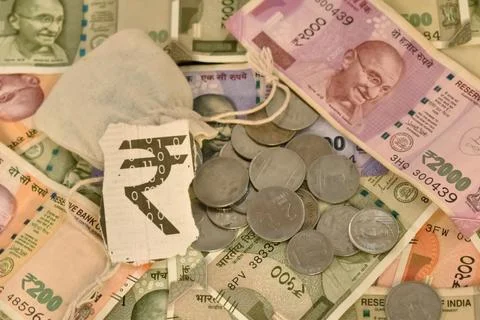 A closeup selective focus of an Indian digital currency with currency notes and Stock Photos