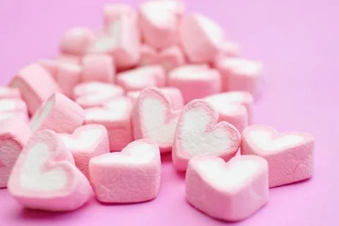Closeup with selective focus pink marshmallows with heart shape Stock Photos