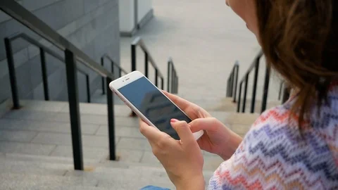 Closeup selective focus young girl hand holding using smartphone Video stock 99098310