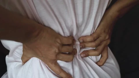 Closeup Senior elderly man touches his waist spine feeling low back pain Video stock 336585212