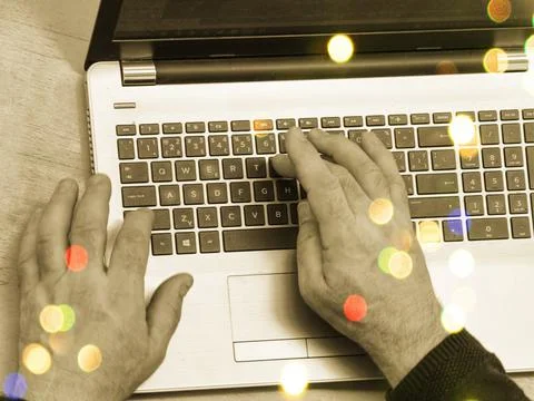 Closeup senior old man hand on laptop keyboard surfing internet Stock Photos