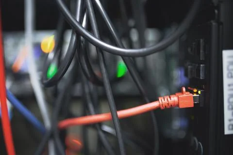 Closeup, servers and rack with cable at data center for database, IT infras.. Stock Photos