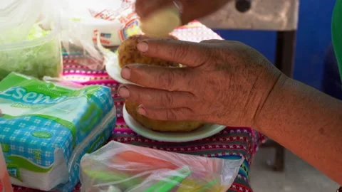 Closeup serving two plates of stuffed potatoes at a classic peruvian breakfast s Stock Footage 198758533