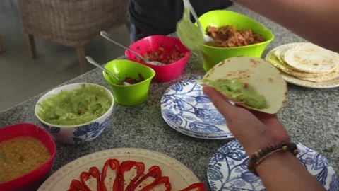Closeup serving various ingredients of a homemade and peruvianized mexican taco Video stock 194470766