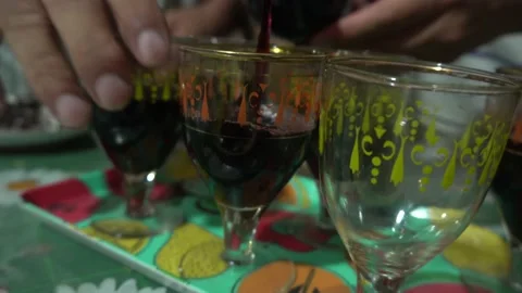 Closeup serving wine from a bottle in crystal glasses on a happy birthday Stock Footage 146676580