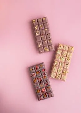 Closeup set of chokolate bars on pink background Stock Photos