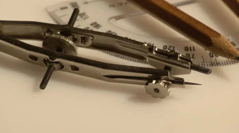 Closeup of a set of compasses and a pencil Stock Footage 61440341