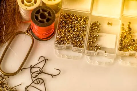Closeup set of different accessories for knitting flies for fly fishing Foto stock