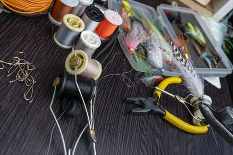 Closeup set of different accessories for knitting flies for fly fishing. To.. Stock Photos