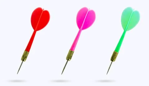 Closeup set of multicolor sharp darts on white background. Stock Photos