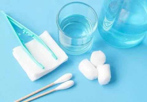 Closeup set of wound dressing on blue background, selective focus Stock Photos