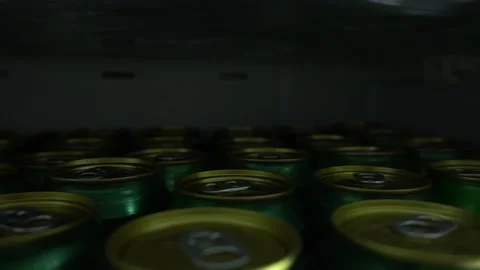 Closeup of several beer cans in a refrigerator 库存影片 192997275