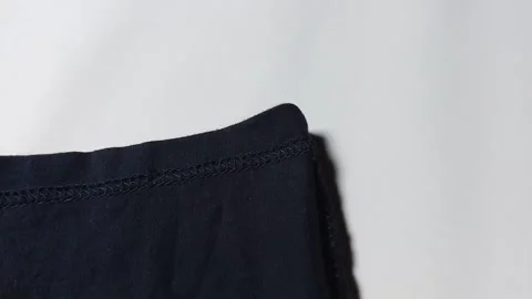 Closeup of sewing clothes, on white background. footage Video stock 296447107