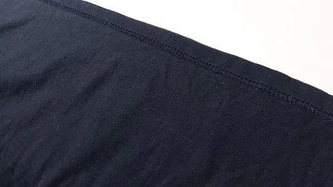 Closeup of sewing clothes, on white background. footage Stock Footage 296447109