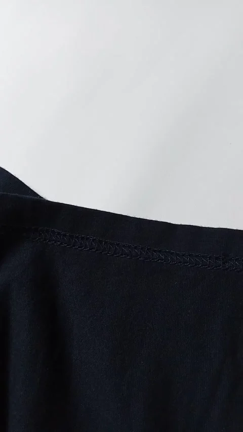 Closeup of sewing clothes, on white background. footage Stock Footage 296447175