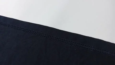 Closeup of sewing clothes, on white background. footage Stock Footage 296447230