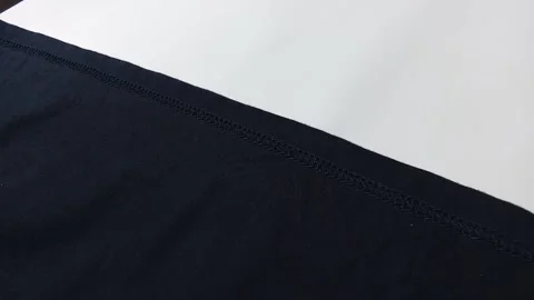 Closeup of sewing clothes, on white background. footage Stock Footage 296447234