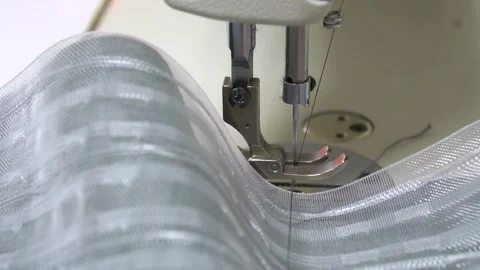 CloseUp of a Sewing Machine Capturing the Intricate Details of Fabric and Stock Footage 310266384