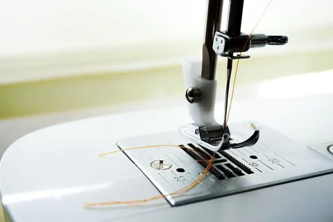 Closeup of a sewing machine needle bobbin and stitch settings 写真素材