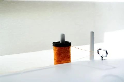 Closeup of a sewing machine needle bobbin and stitch settings Stockfoto's