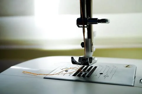 Closeup of a sewing machine needle bobbin and stitch settings 写真素材