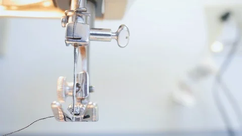Closeup of a Sewing Machine Stitching in 4k Stock Footage 88604087