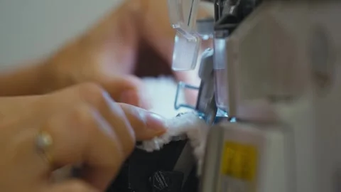 CloseUp of Sewing Machine Stitching Soft White Fabric Stock Footage 319028945