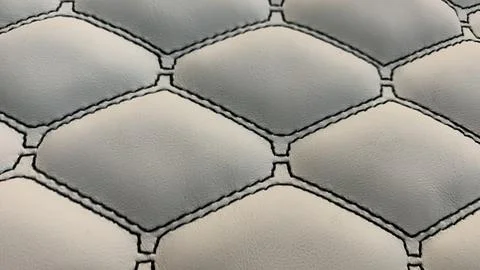 Closeup sewing pattern with grey leather Stock Photos