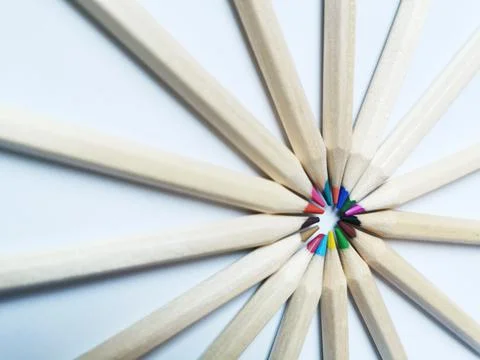 Closeup of sharp color pencils put close to each other on the white paper Stock Photos