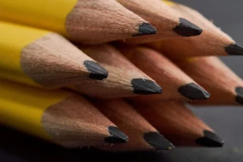 Closeup of the sharp ends of stack of writing pencils Stock Photos