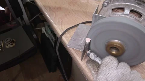 Closeup of sharpening a soldering iron for work. Preparing the tool for work. Stock-Footage 130779686