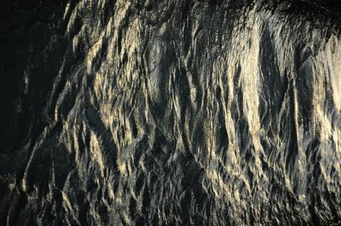 Closeup of a shiny reflective rock surface similar 스톡 사진